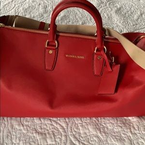 Michael Kors small red duffle bag